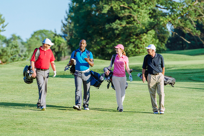 People walking on golf course.