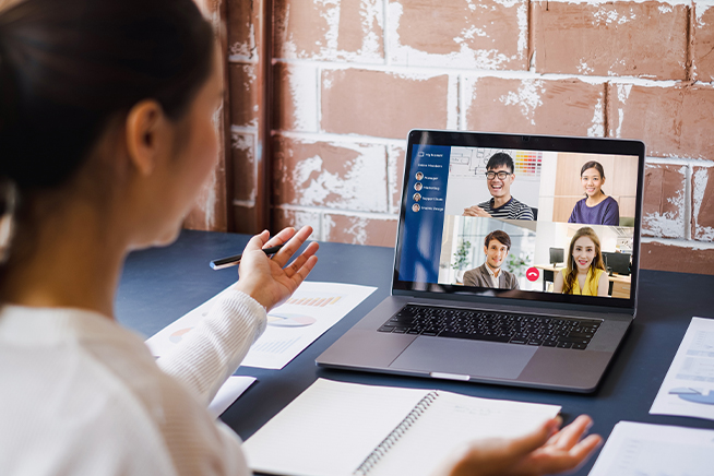 Woman attending a zoom meeting.