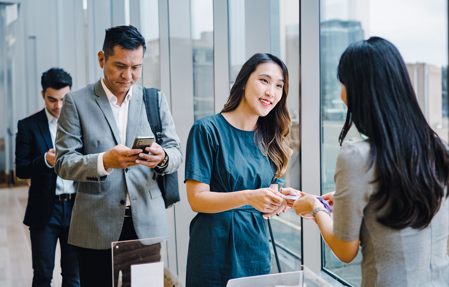 Professionals line up to check in for event