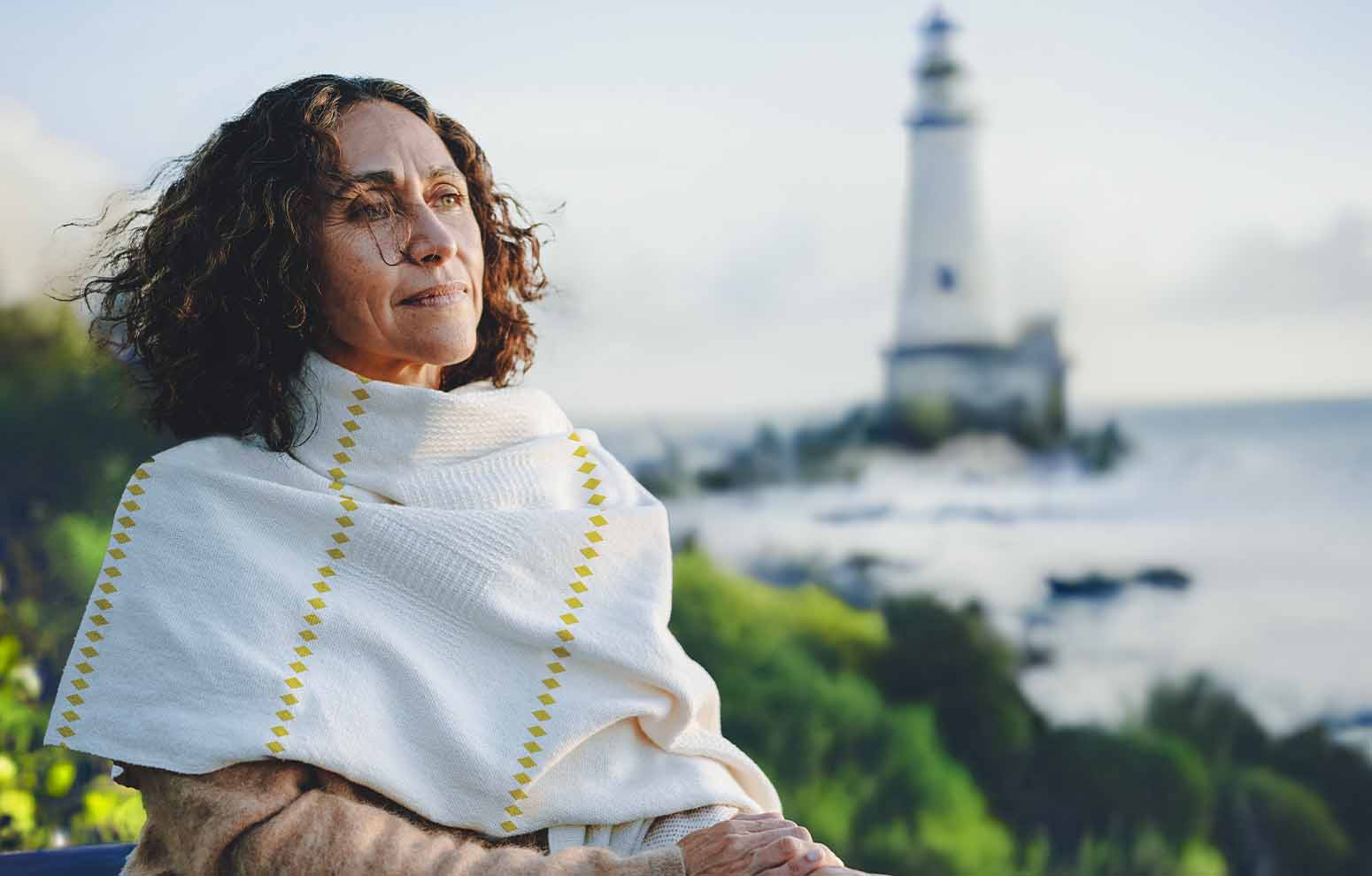 Woman standing by the ocean. 