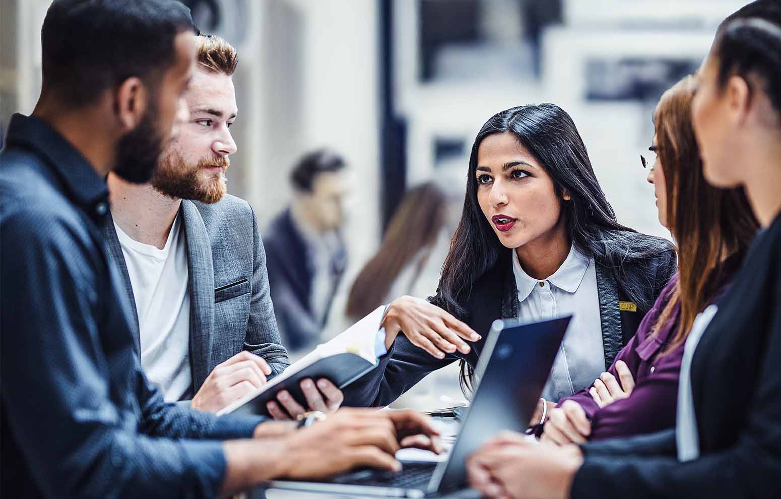 Business people using laptop computer.