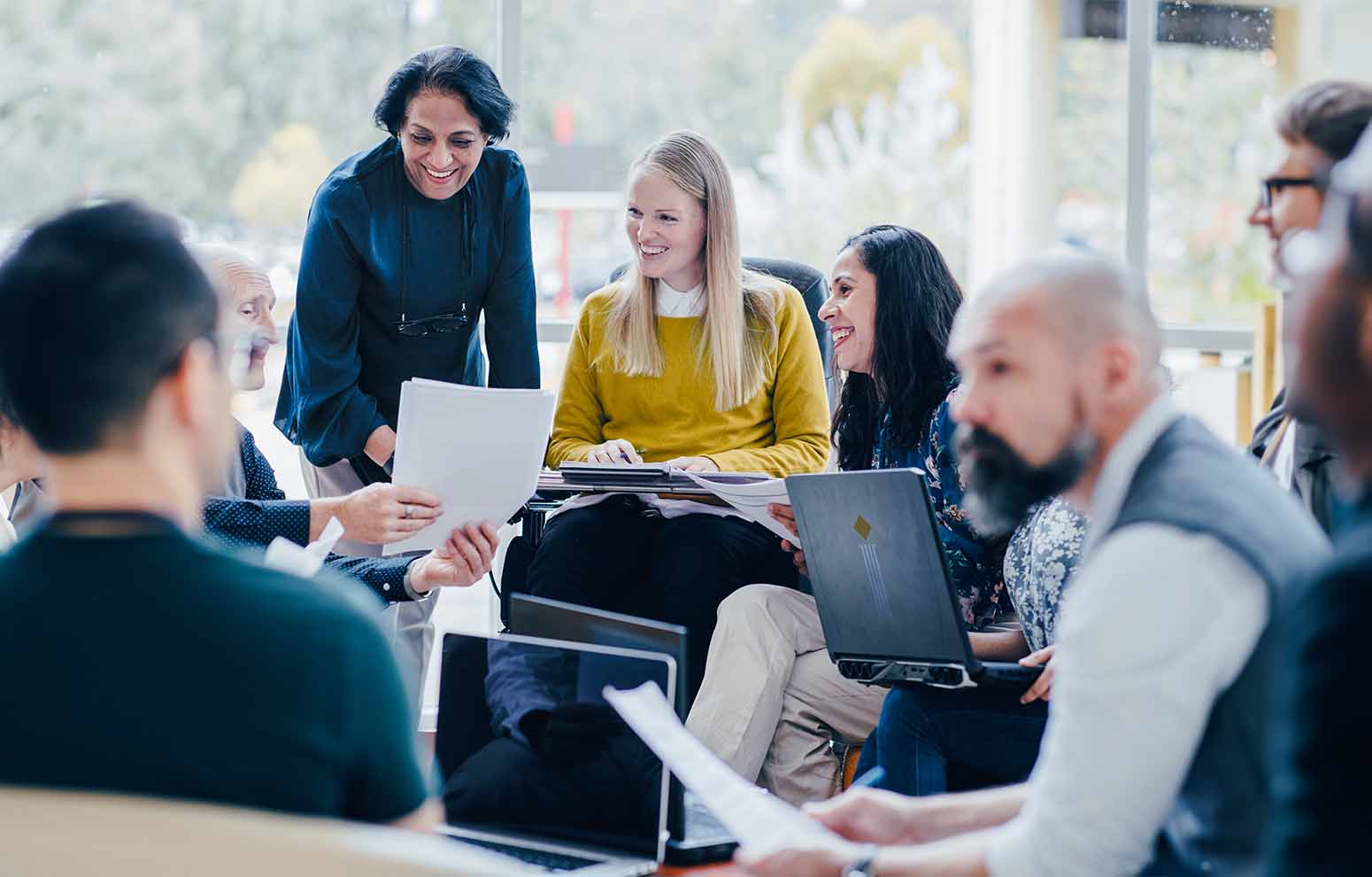 Students chat and study a document