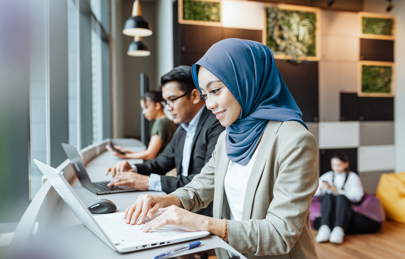 Line of students on laptops