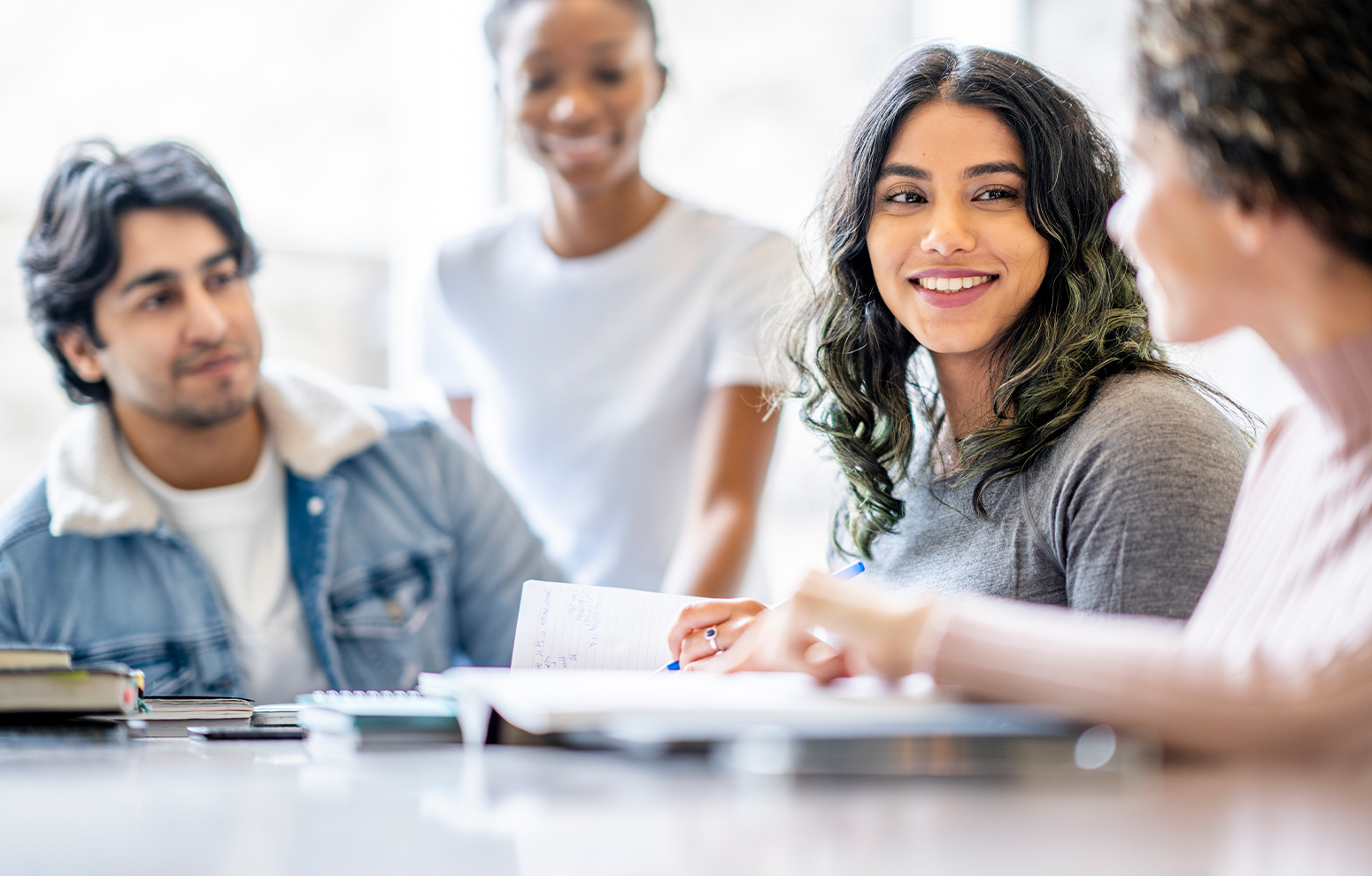 Students chat and study a document