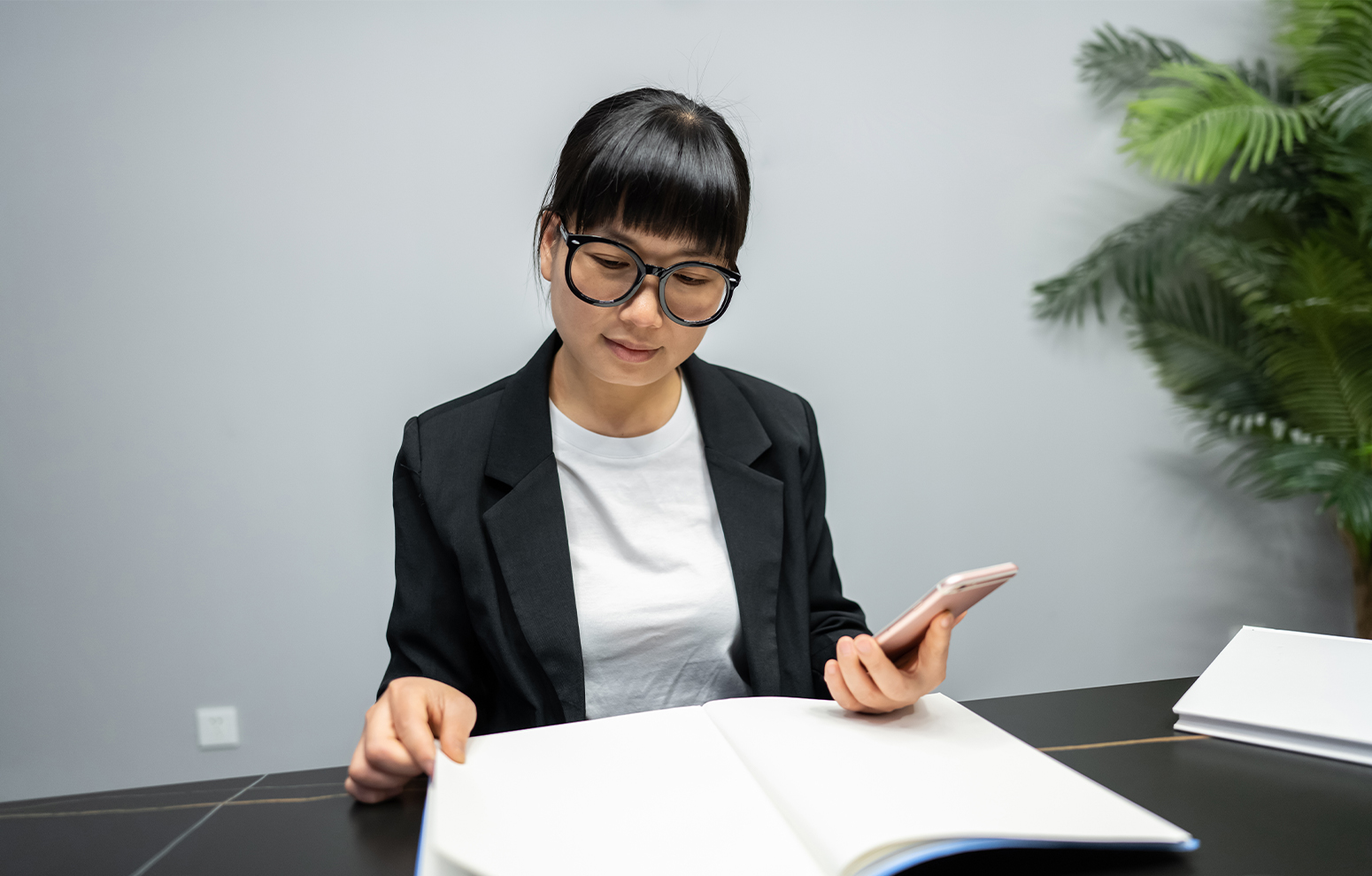 Woman wearing headphones using computer.