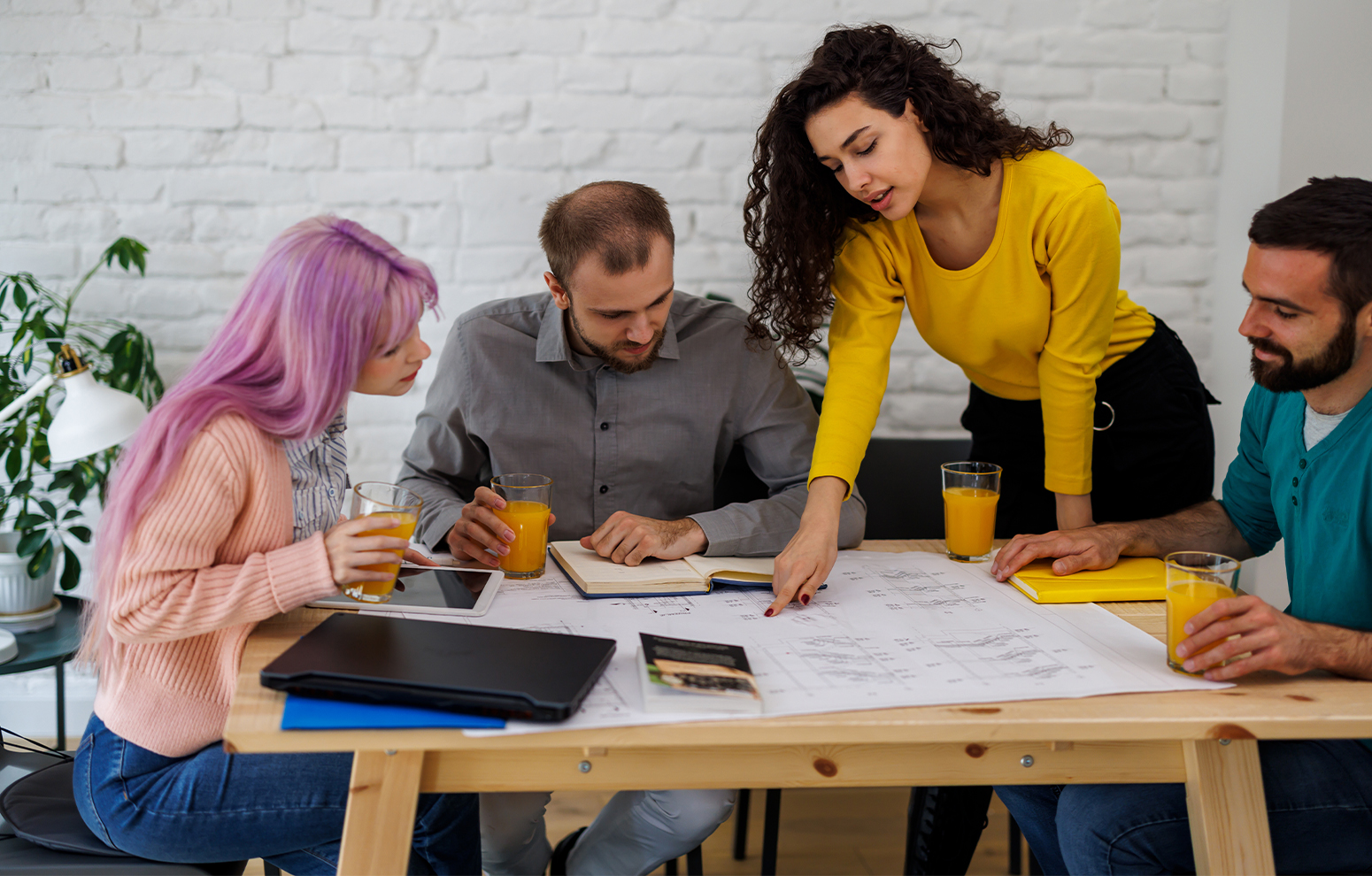 Colleagues study a document together during a meeting 