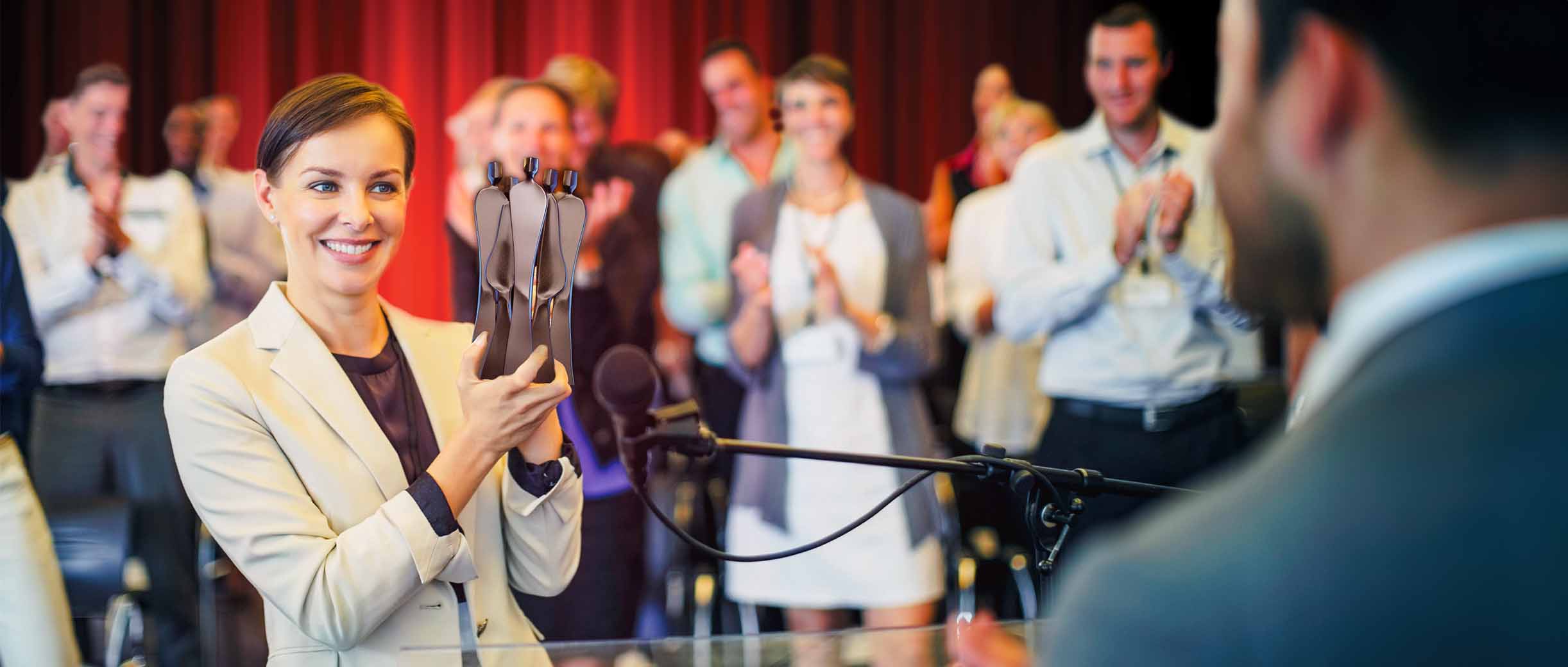 People applauding at an event.