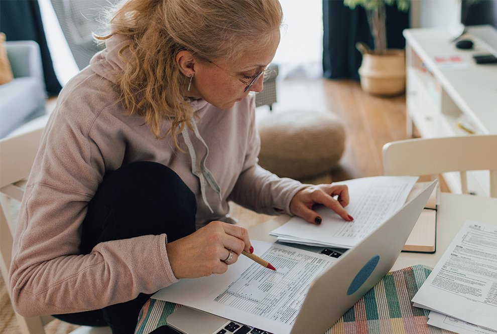 Woman studies at the computer.