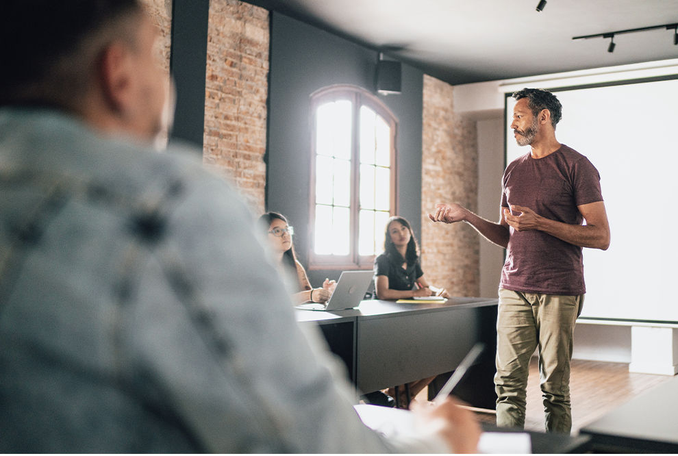 A man standing and talking.