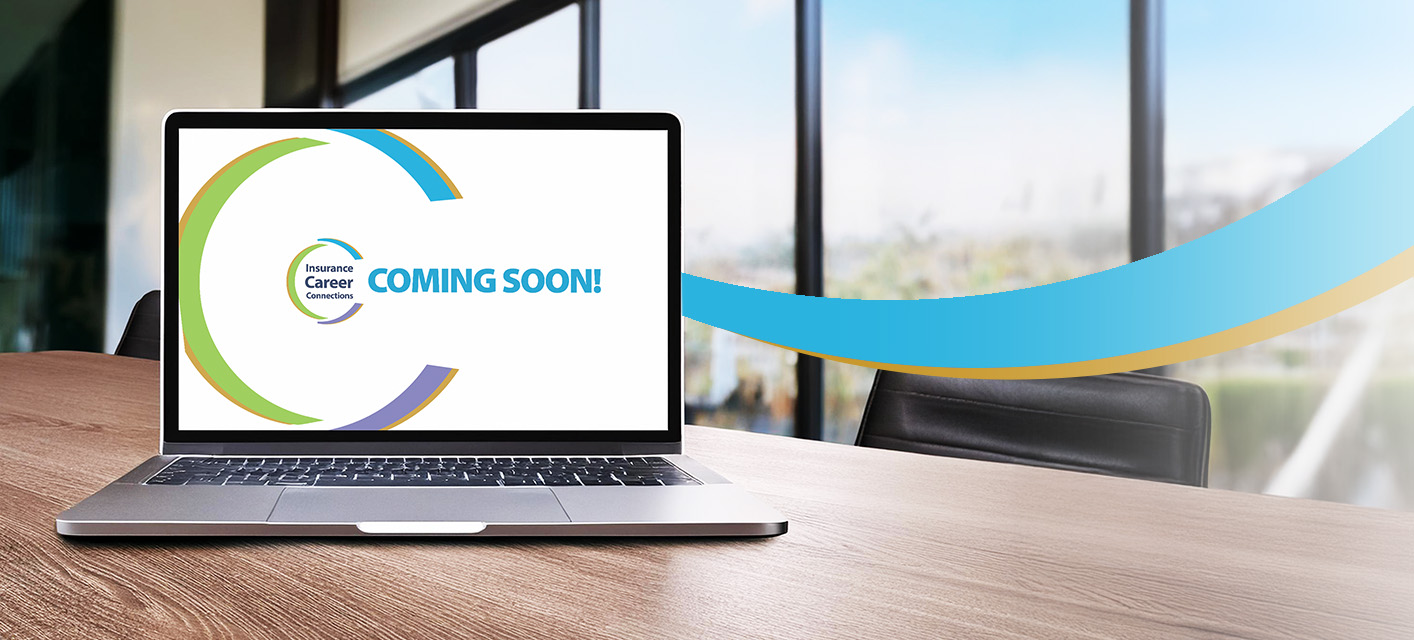 Laptop on desk with words 'coming soon'