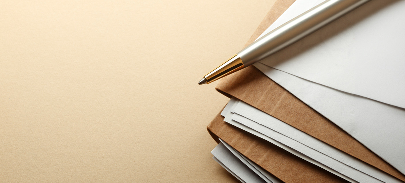 Paper files on table