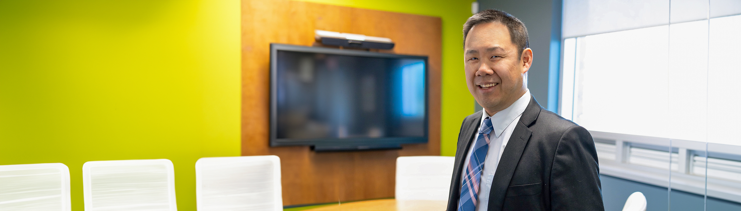 man standing in office smiling